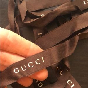 Brown Gucci ribbon with silver text
